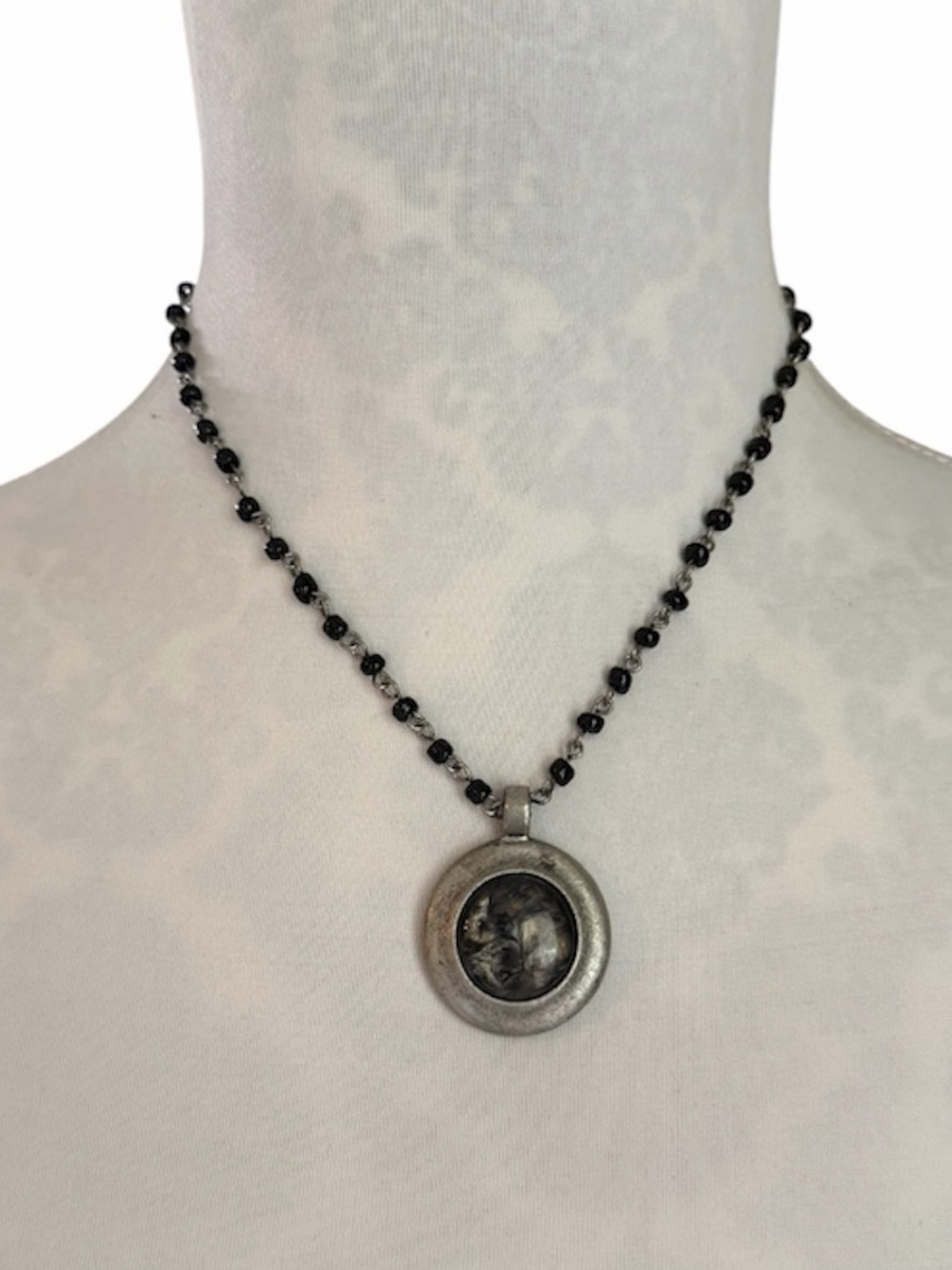 Black Beaded Necklace with Silver Tone Round Pendant